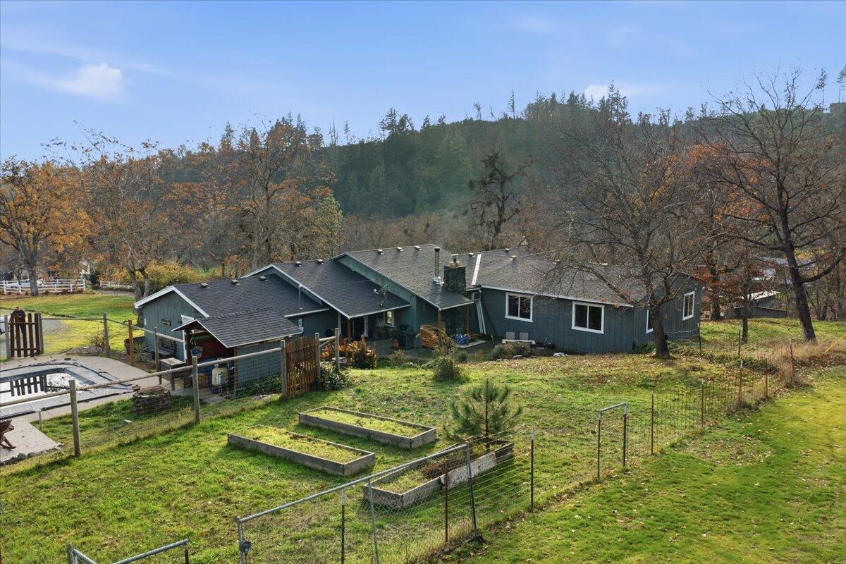 1360 Oxyoke Road Grants Pass, OR 97526 - Photo 32 of 39 a view of a house with a big yard