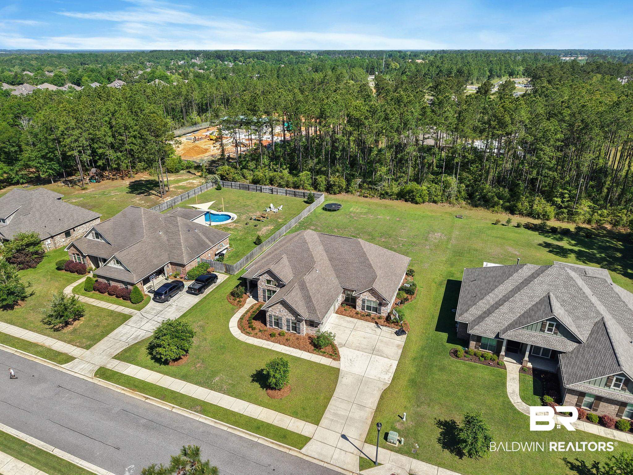 31911 Bobwhite Road Daphne, AL 36527 - Photo 67 of 85 Aerial view of residential area with a heavily wooded area