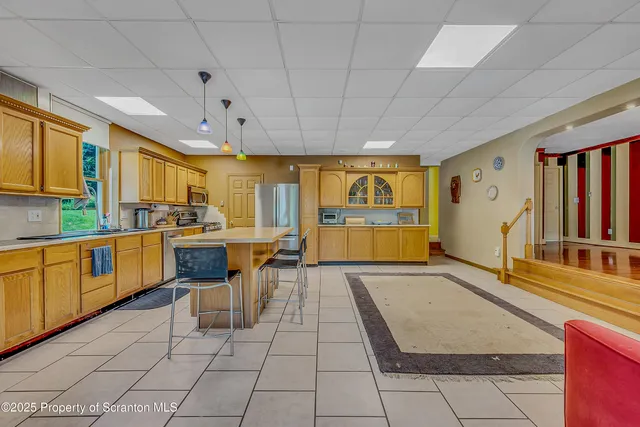 a kitchen with sink cabinets and window