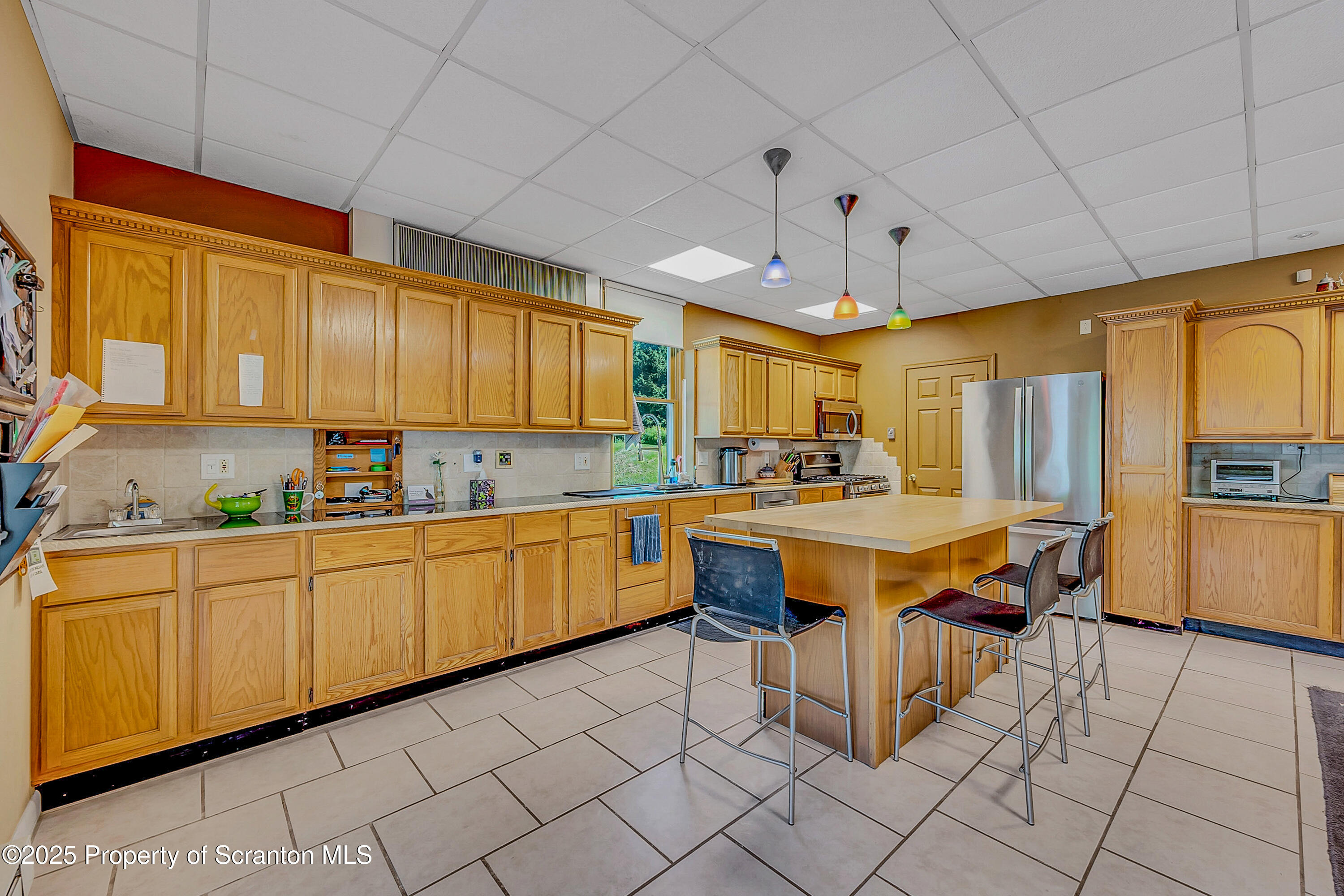 831 Montdale Road Scott Township, PA 18447 - Photo 15 of 46 a kitchen with granite countertop a sink and cabinets