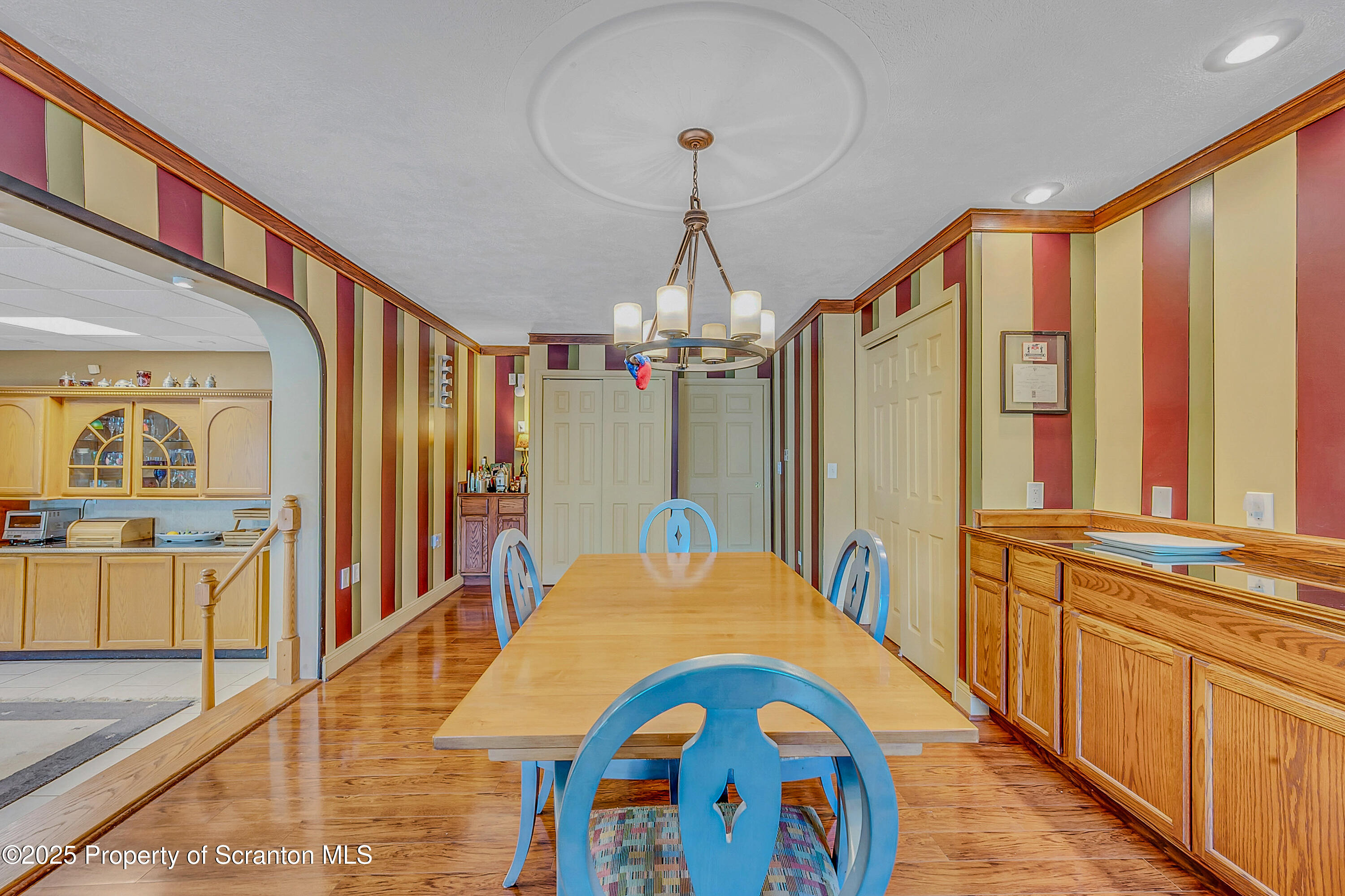 831 Montdale Road Scott Township, PA 18447 - Photo 18 of 46 a bedroom with window and a chandelier