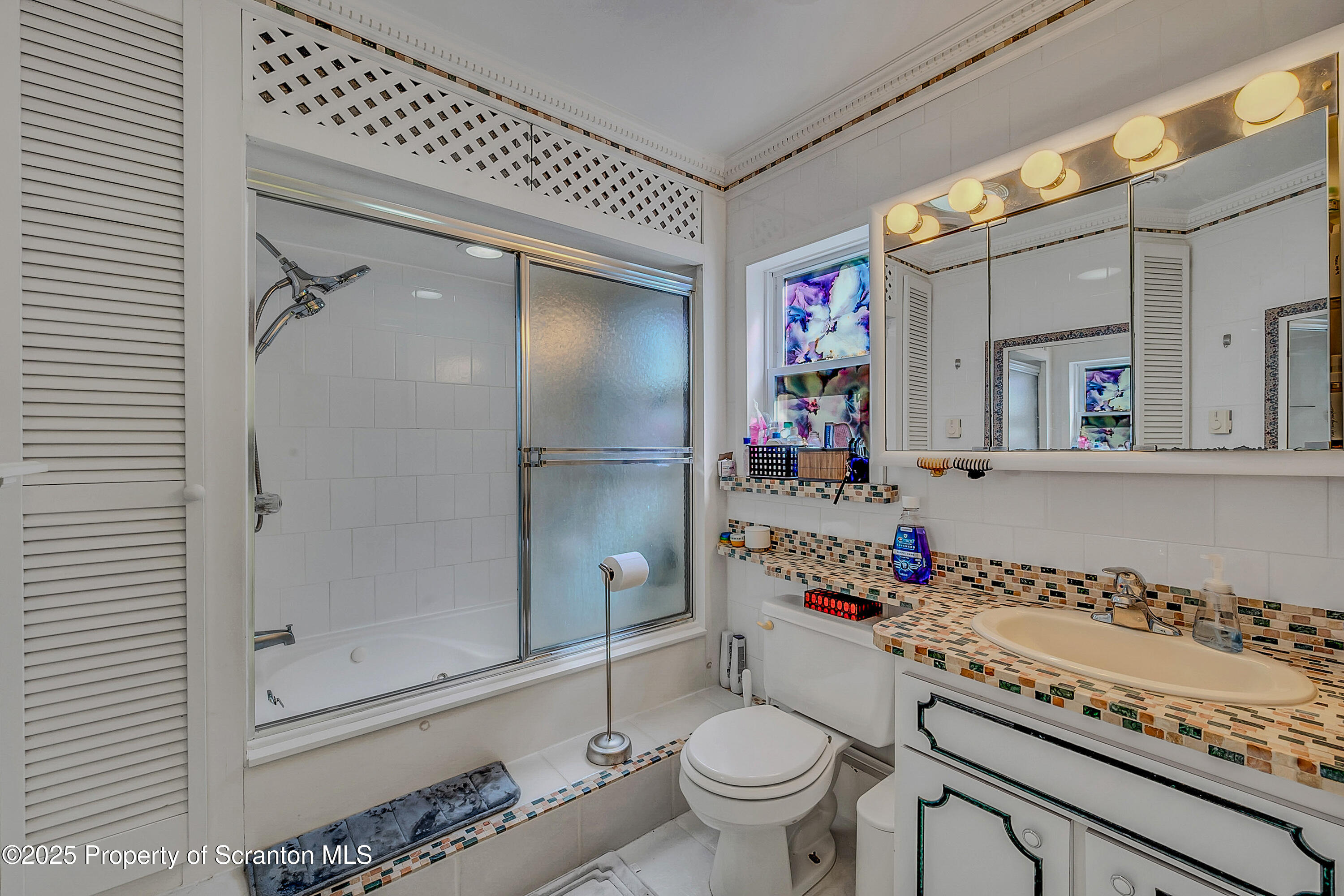 831 Montdale Road Scott Township, PA 18447 - Photo 20 of 46 a bathroom with a granite countertop sink mirror vanity and toilet