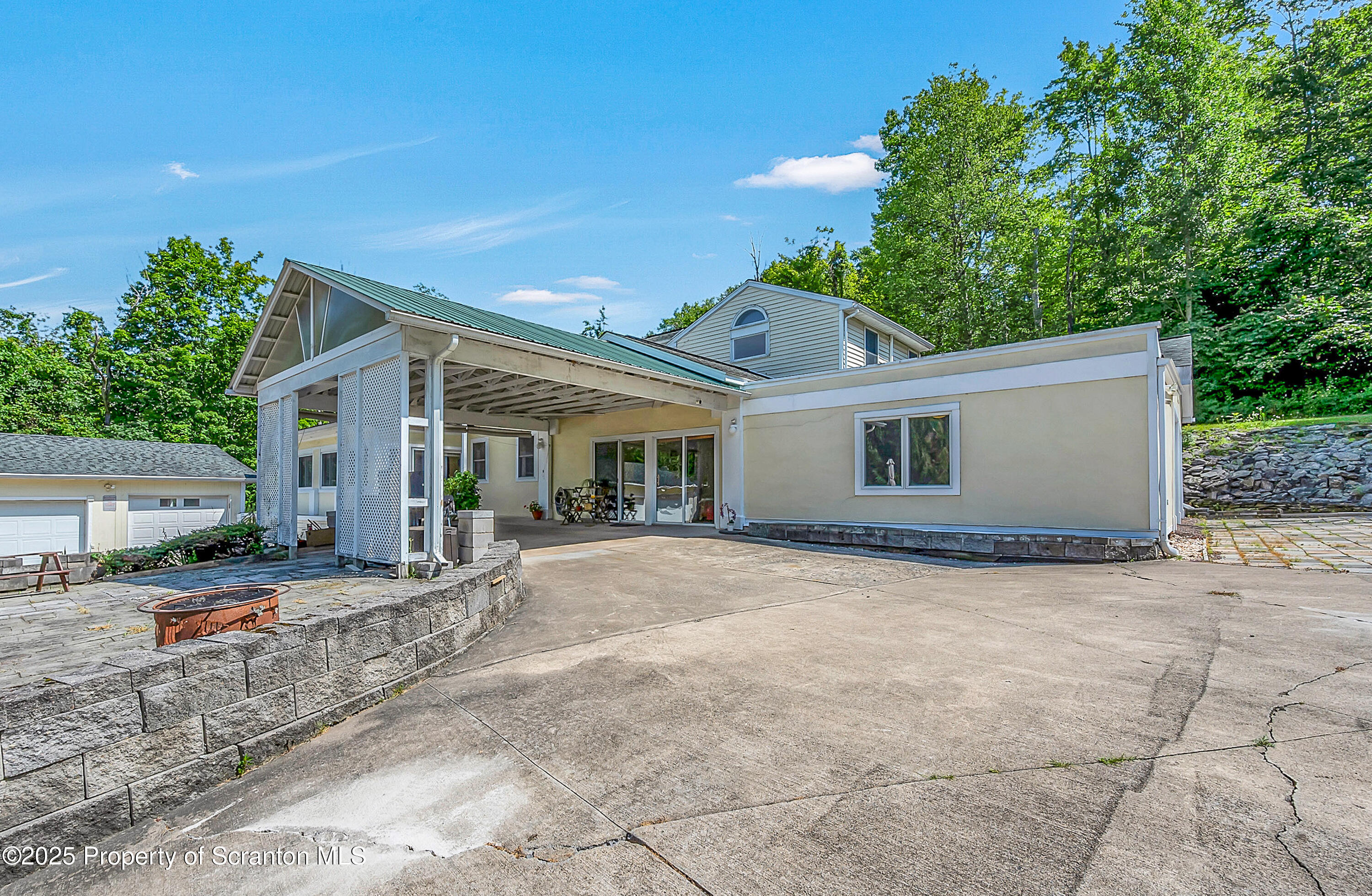 831 Montdale Road Scott Township, PA 18447 - Photo 2 of 46 a view of a house with backyard and trees