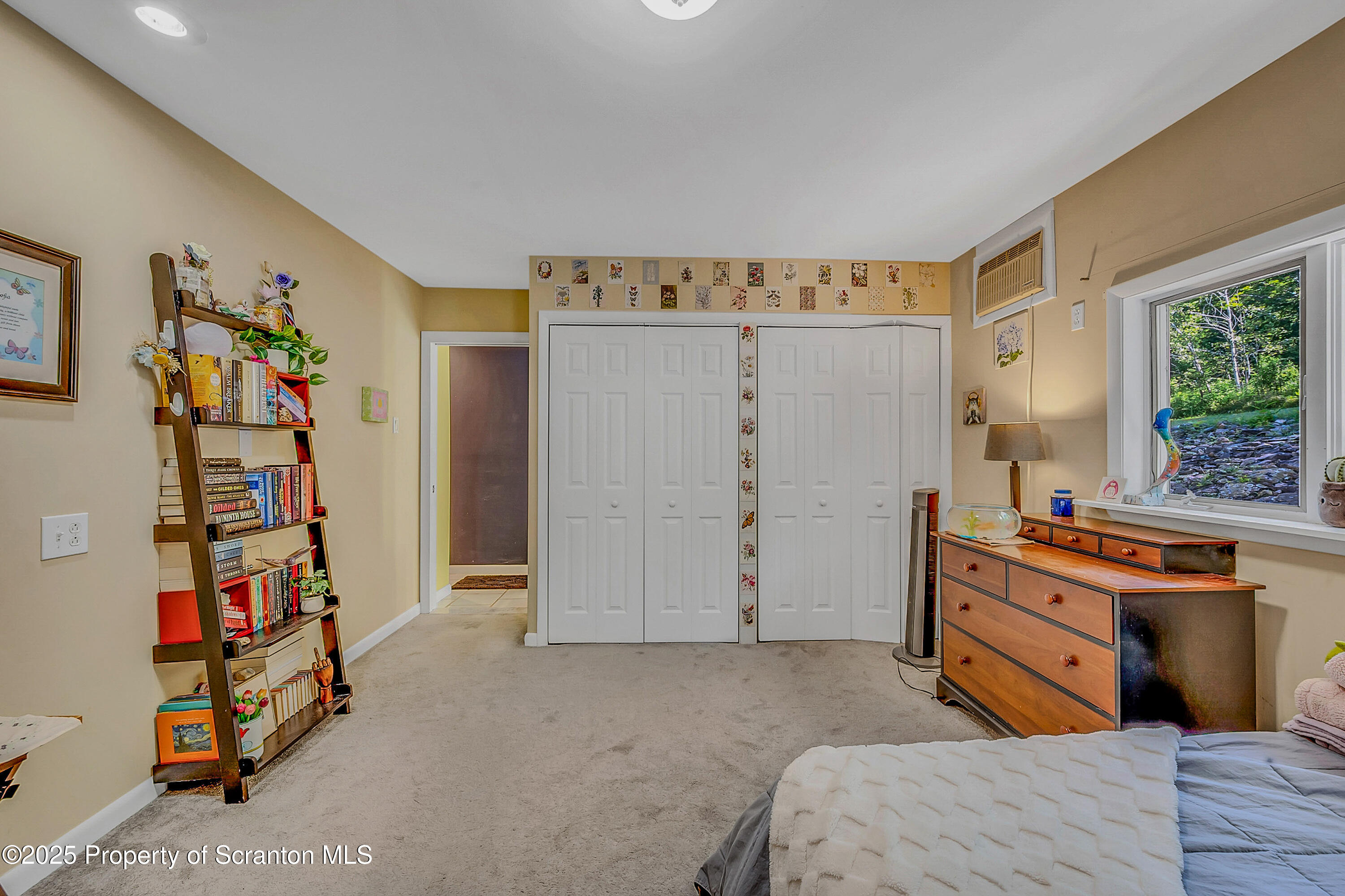 831 Montdale Road Scott Township, PA 18447 - Photo 21 of 46 a bedroom with a bed and a window