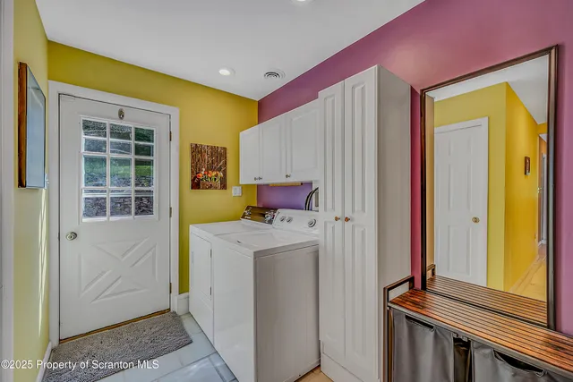 a view of hallway with washer and dryer