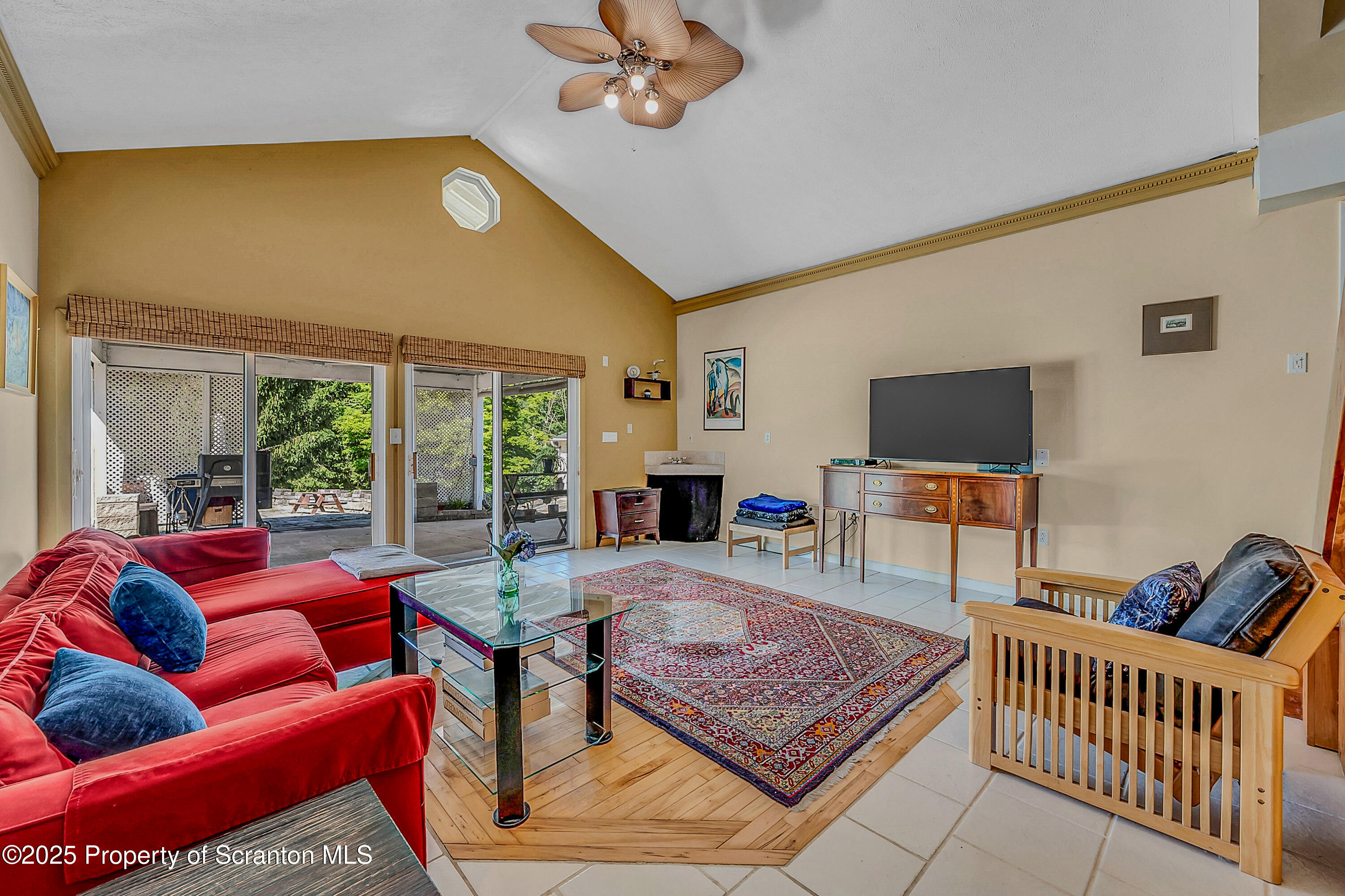 831 Montdale Road Scott Township, PA 18447 - Photo 28 of 46 a living room with furniture and a flat screen tv