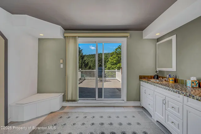 a bathroom with a double vanity sink toilet and shower