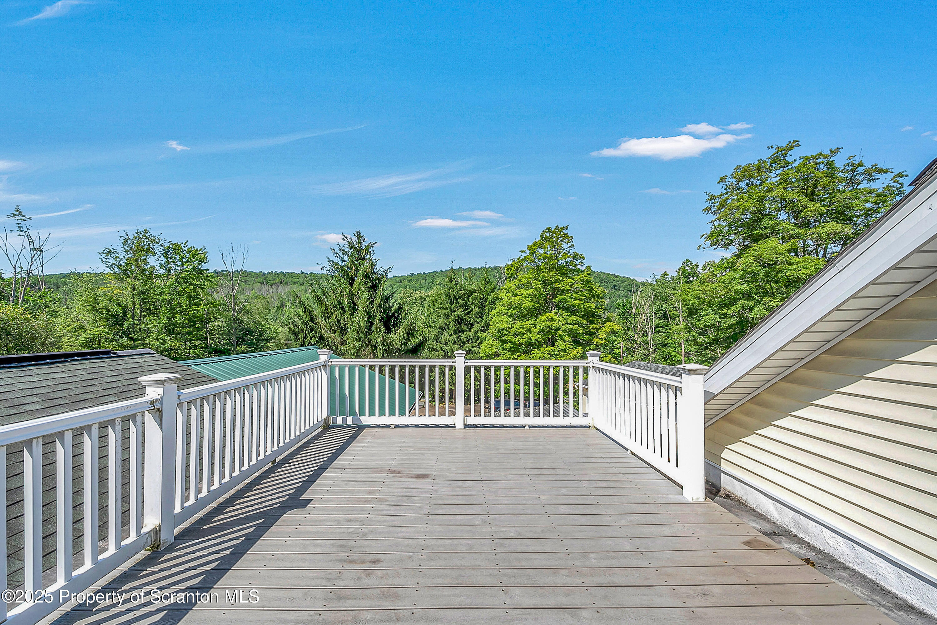 831 Montdale Road Scott Township, PA 18447 - Photo 37 of 46 a balcony with wooden floor and fence
