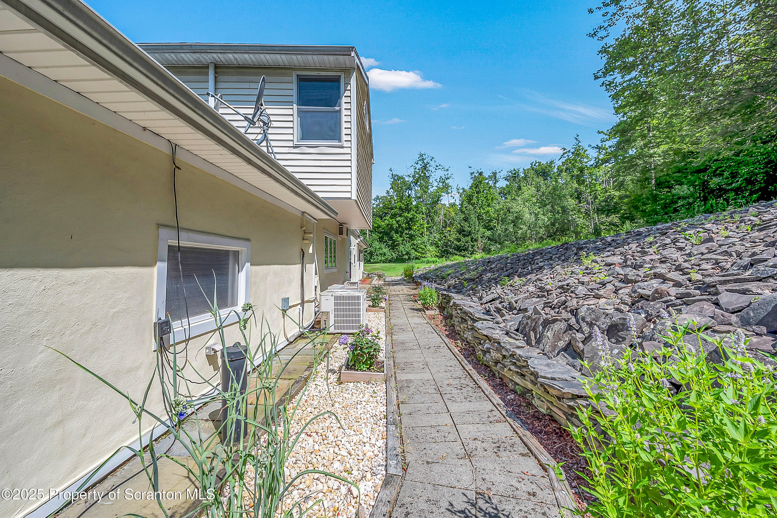 831 Montdale Road Scott Township, PA 18447 - Photo 41 of 46 a balcony with chairs and wooden fence