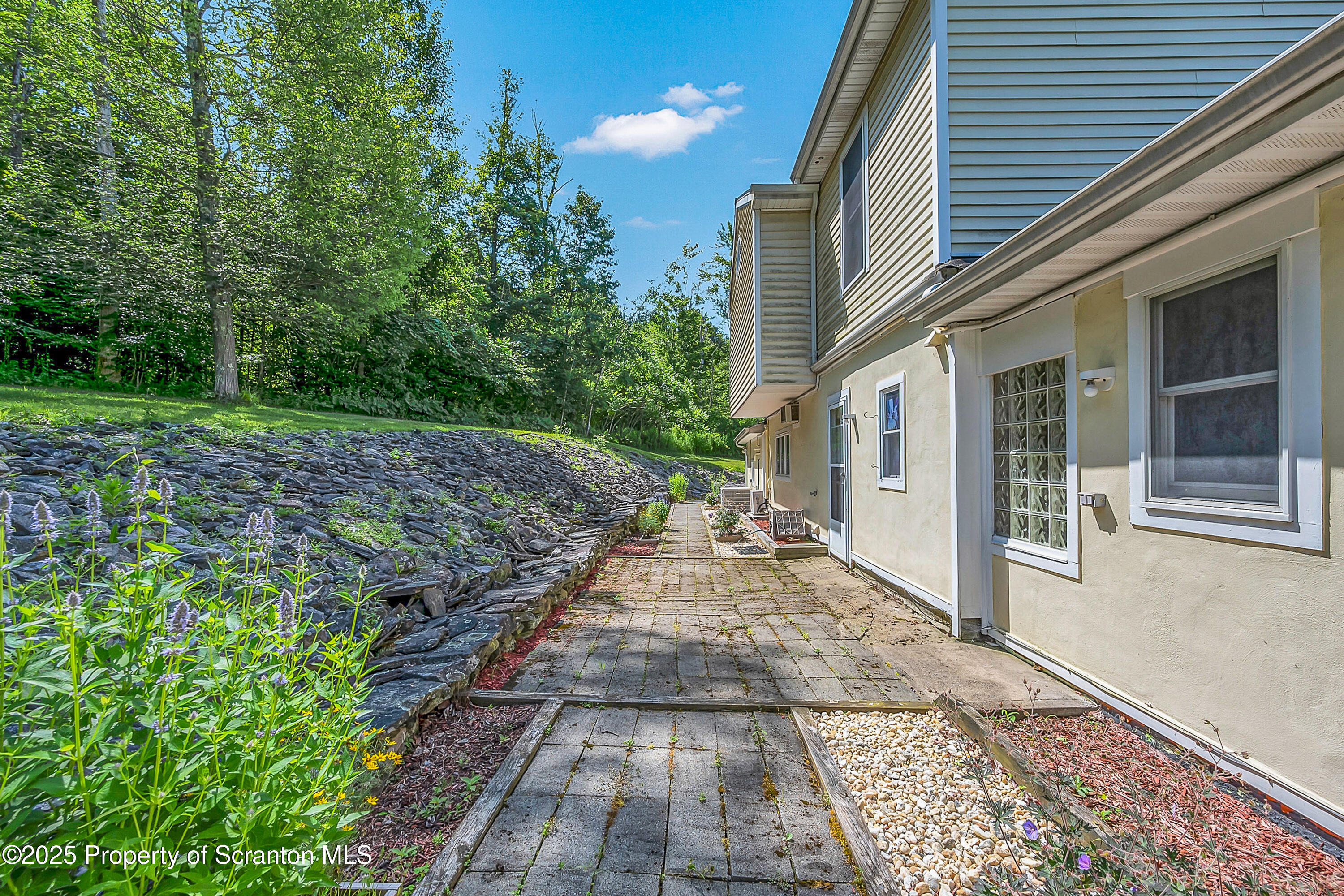831 Montdale Road Scott Township, PA 18447 - Photo 42 of 46 a view of a pathway with a house