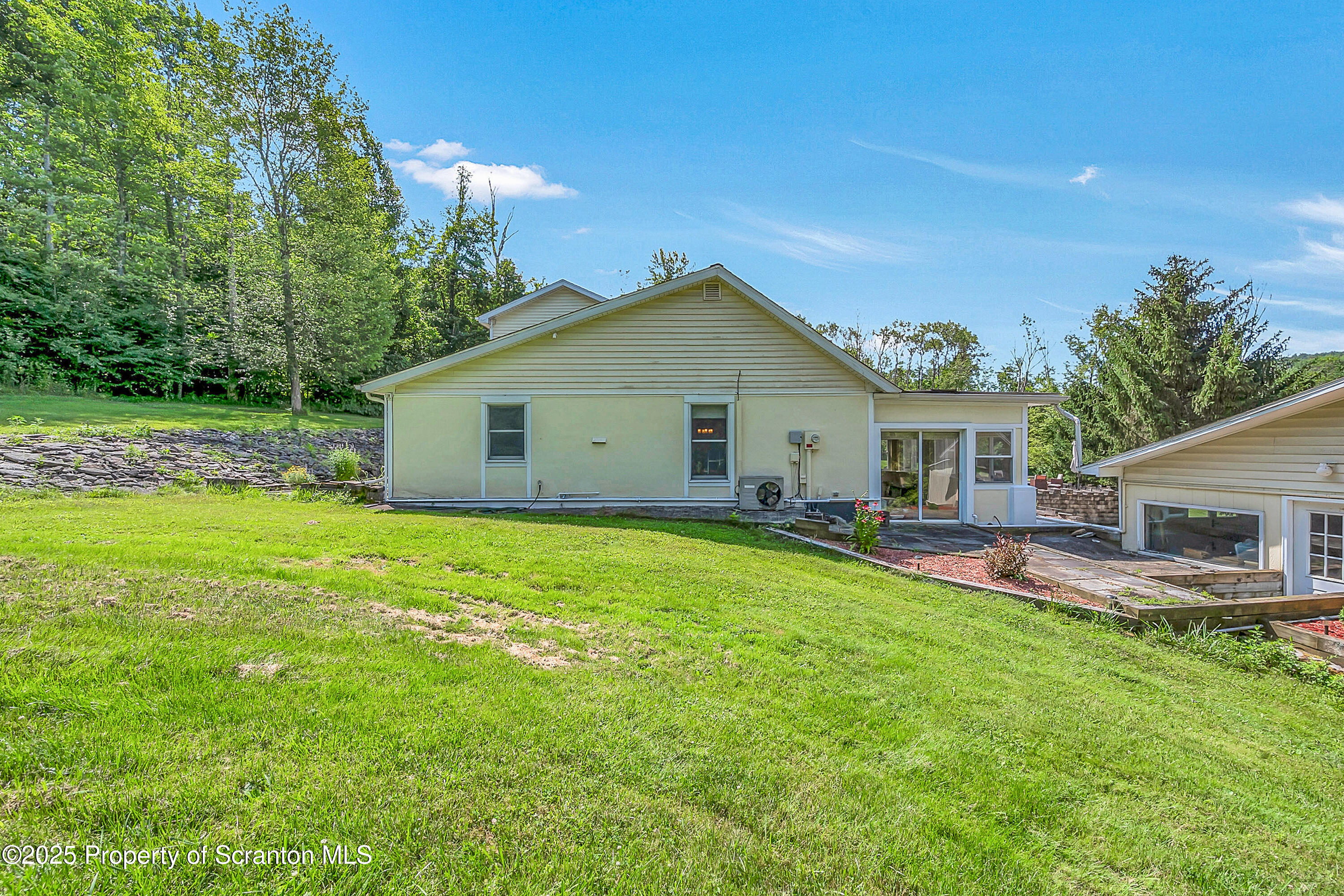 831 Montdale Road Scott Township, PA 18447 - Photo 5 of 46 a view of a house with a yard and sitting area