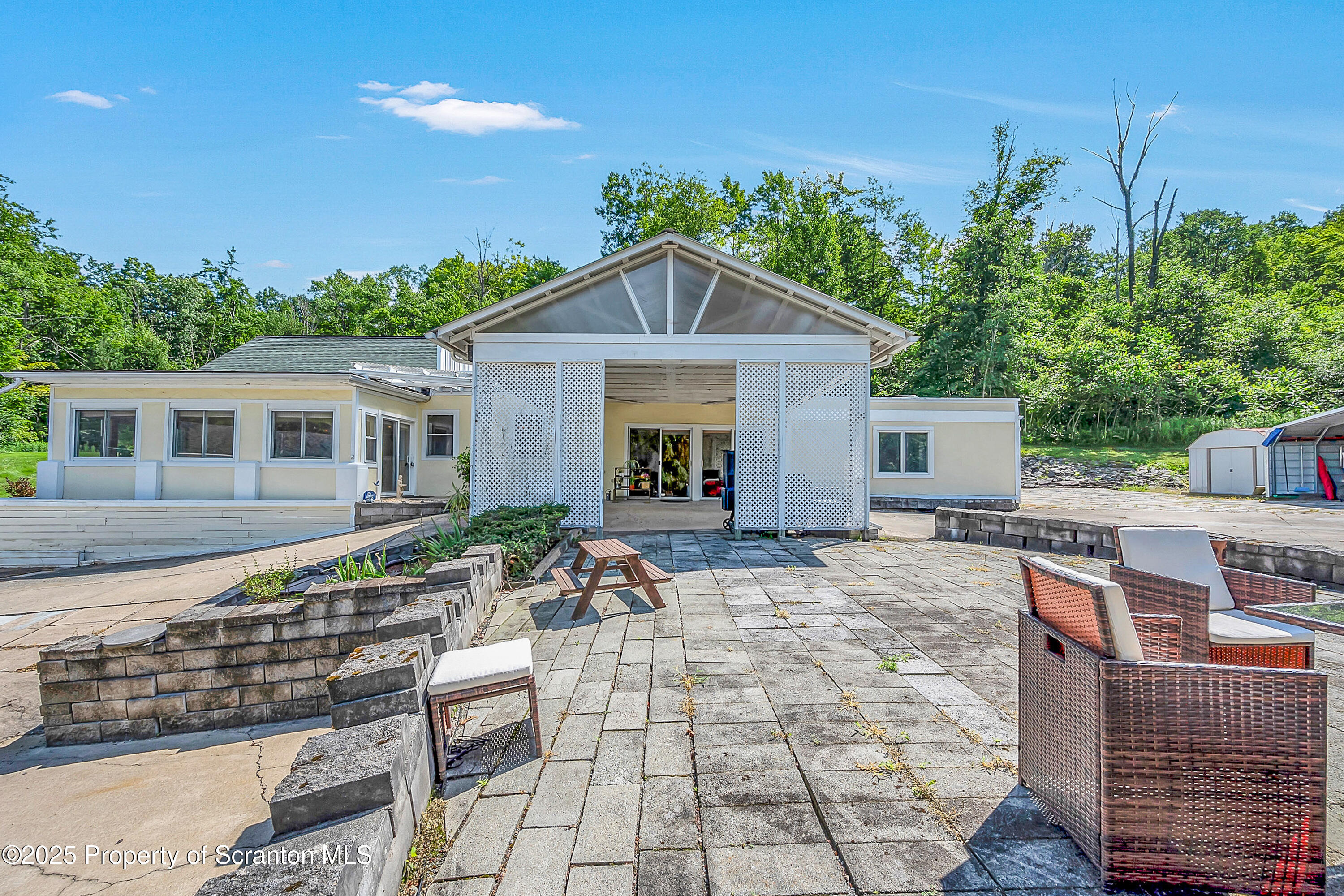 831 Montdale Road Scott Township, PA 18447 - Photo 9 of 46 a view of a house with backyard sitting area and garden