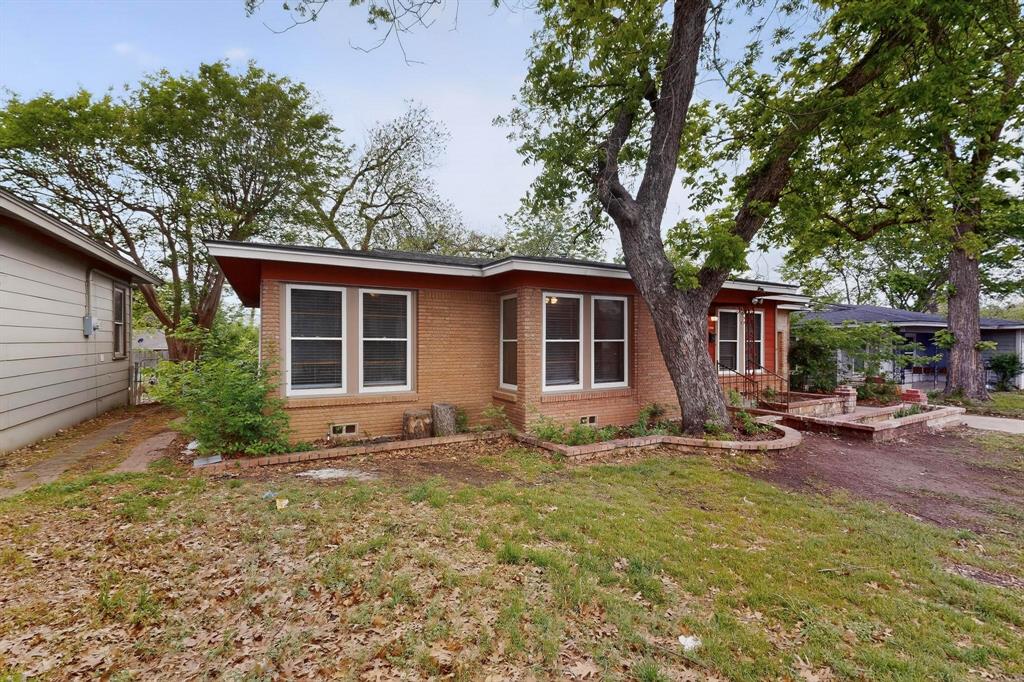 4508 Rutland Avenue Fort Worth, TX 76133 - Photo 1 of 36 a view of a house with backyard sitting area and garden