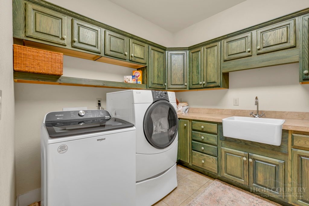 160 Outback Road Ferguson, NC 28624 - Photo 32 of 49 a utility room with closet dryer and washer