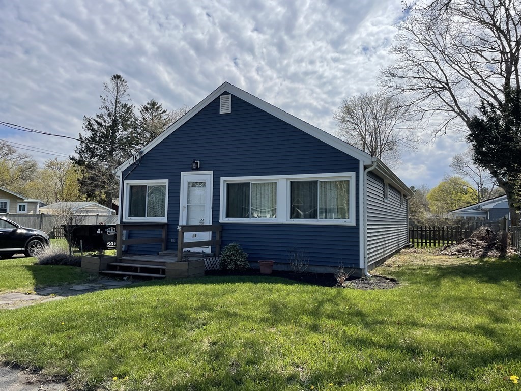 26 Wenonah Road Wareham, MA 02532 - Photo 3 of 21 a front view of a house with garden