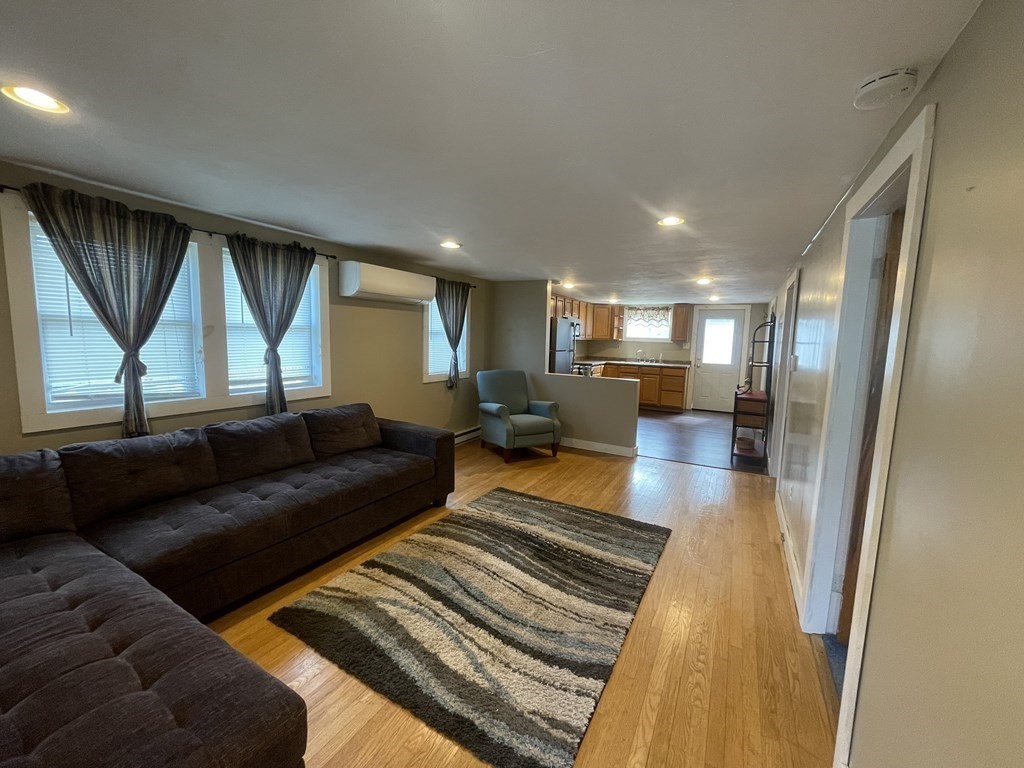 26 Wenonah Road Wareham, MA 02532 - Photo 8 of 21 a living room with furniture and a large window