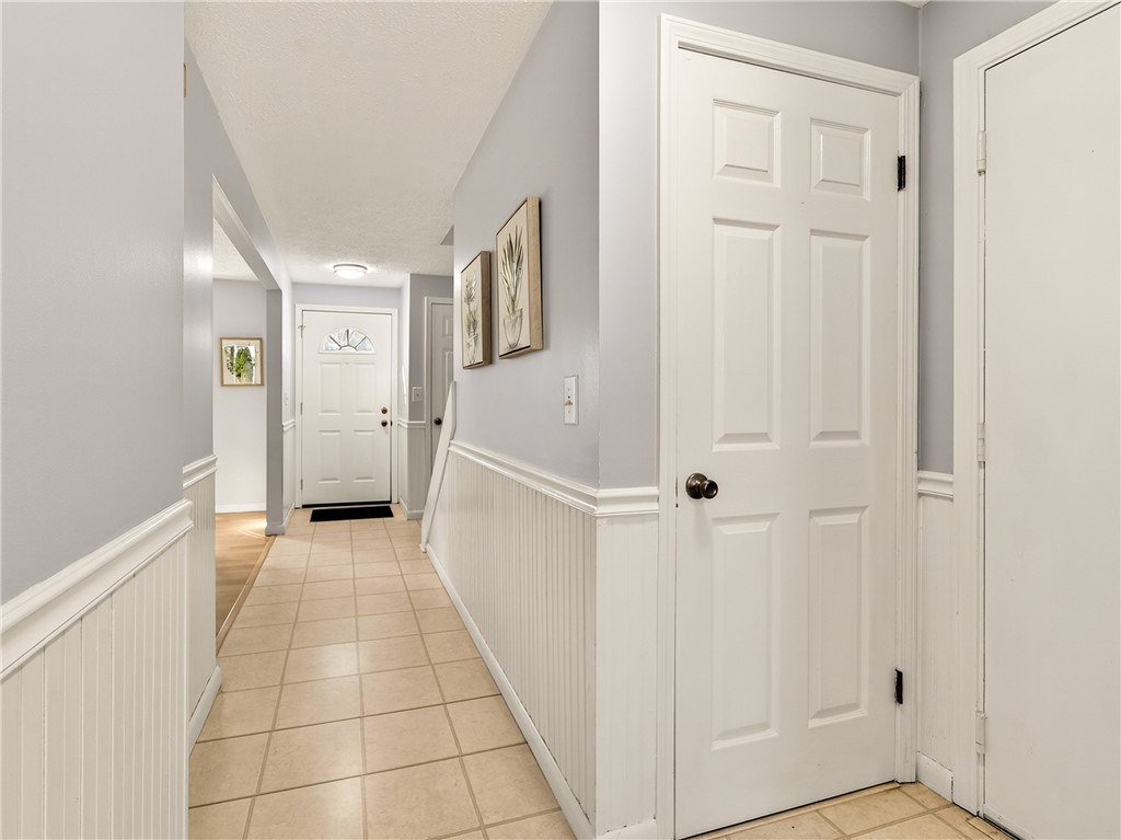 152 Fawn Lane Webster, NY 14580 - Photo 14 of 30 First Floor hall with access to the Lower Level an