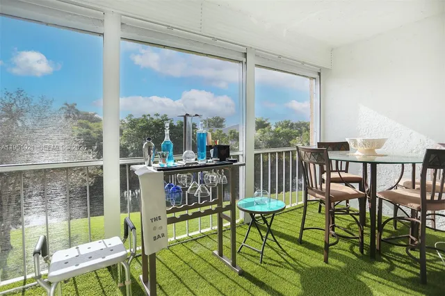 a view of a balcony with chairs