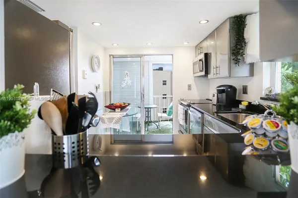 a living room with furniture and flat screen tv