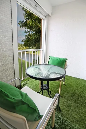 a view of a outdoor sitting area with furniture