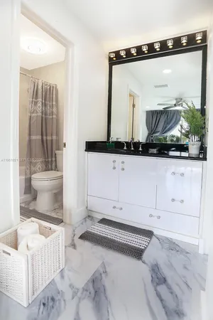 a bedroom with a bed and dresser