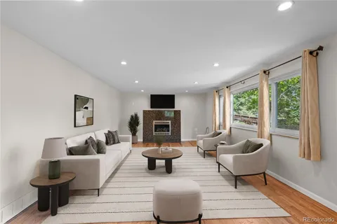 a living room with furniture and a large window