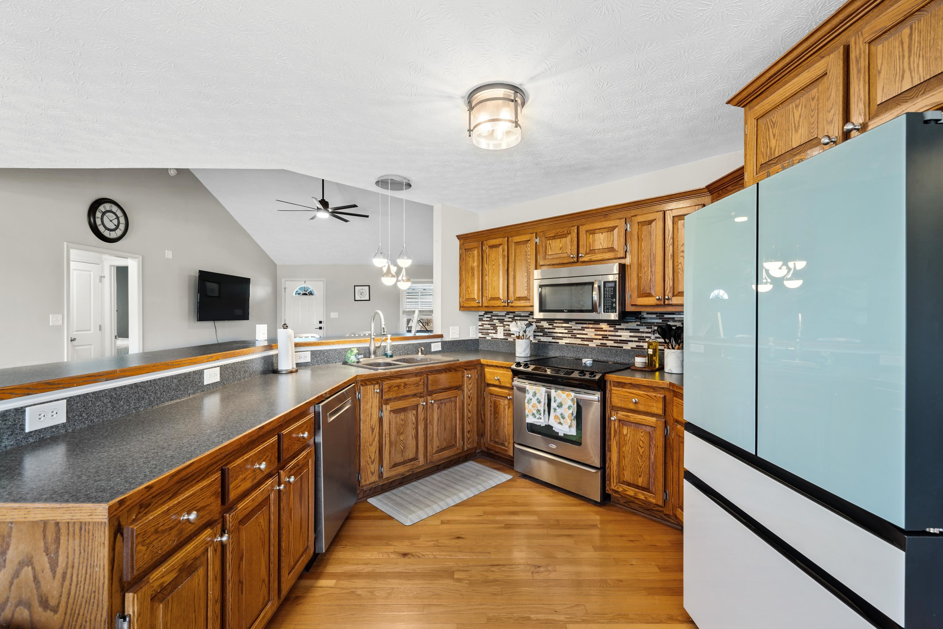 105 Stone Drive Stuarts Draft, VA 24477 - Photo 14 of 62 a large kitchen with stainless steel appliances granite countertop a sink and a stove