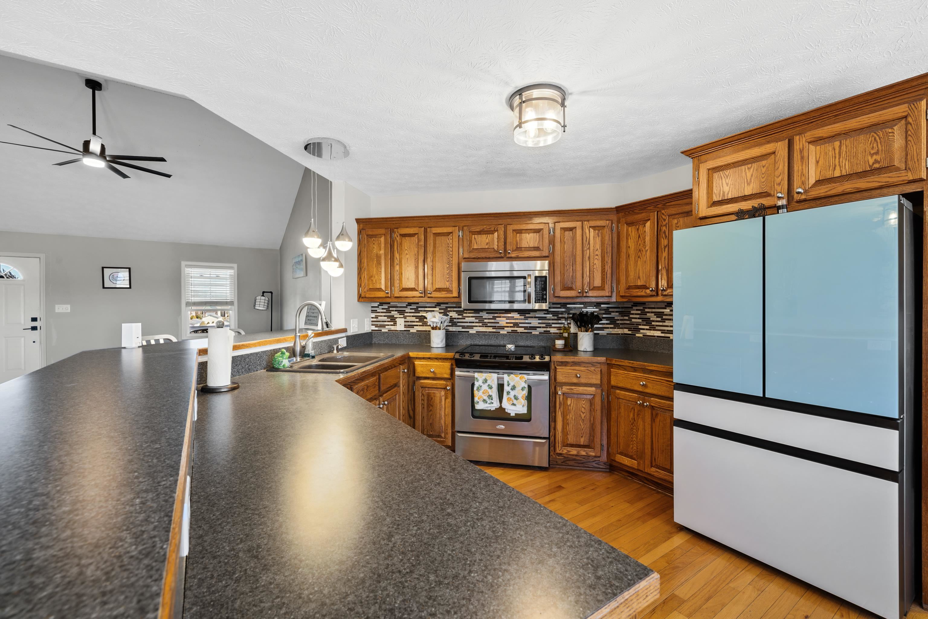 105 Stone Drive Stuarts Draft, VA 24477 - Photo 23 of 62 a kitchen with stainless steel appliances granite countertop a refrigerator a stove and a sink with cabinets