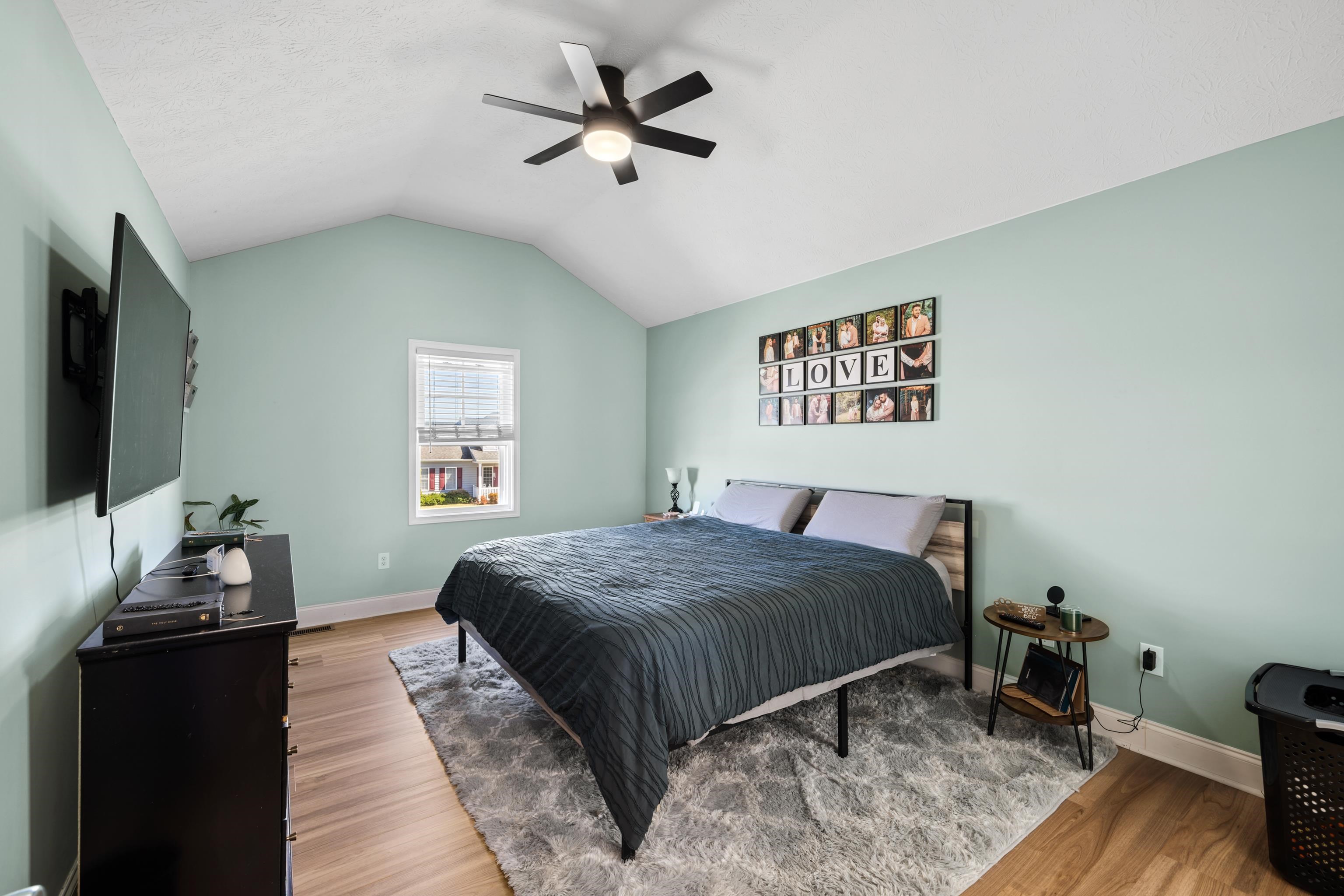 105 Stone Drive Stuarts Draft, VA 24477 - Photo 28 of 62 a bedroom with a bed and a flat screen tv