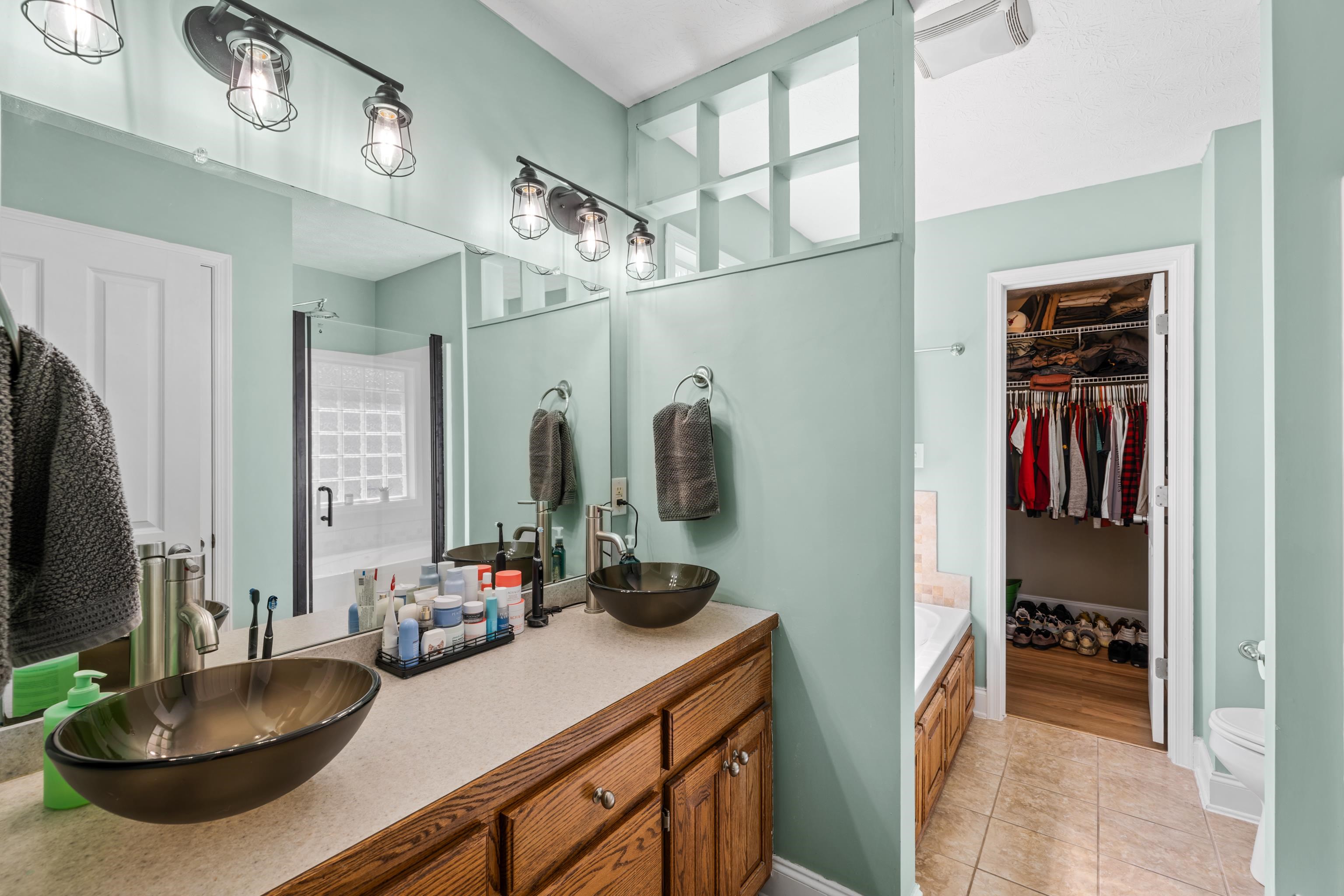 105 Stone Drive Stuarts Draft, VA 24477 - Photo 31 of 62 a room with furniture a flat screen tv and a sink