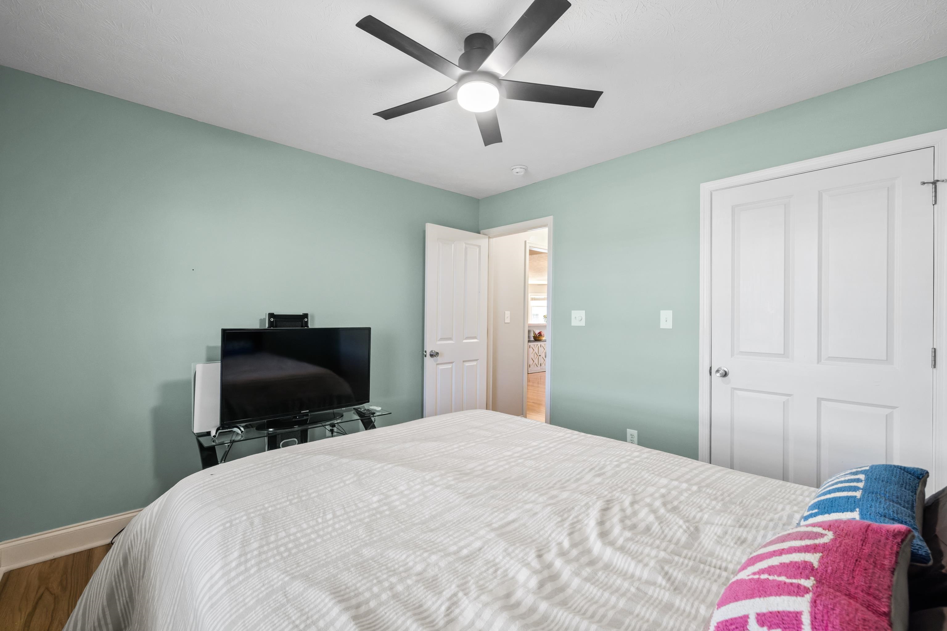 105 Stone Drive Stuarts Draft, VA 24477 - Photo 38 of 62 a bedroom with a bed and a chandelier