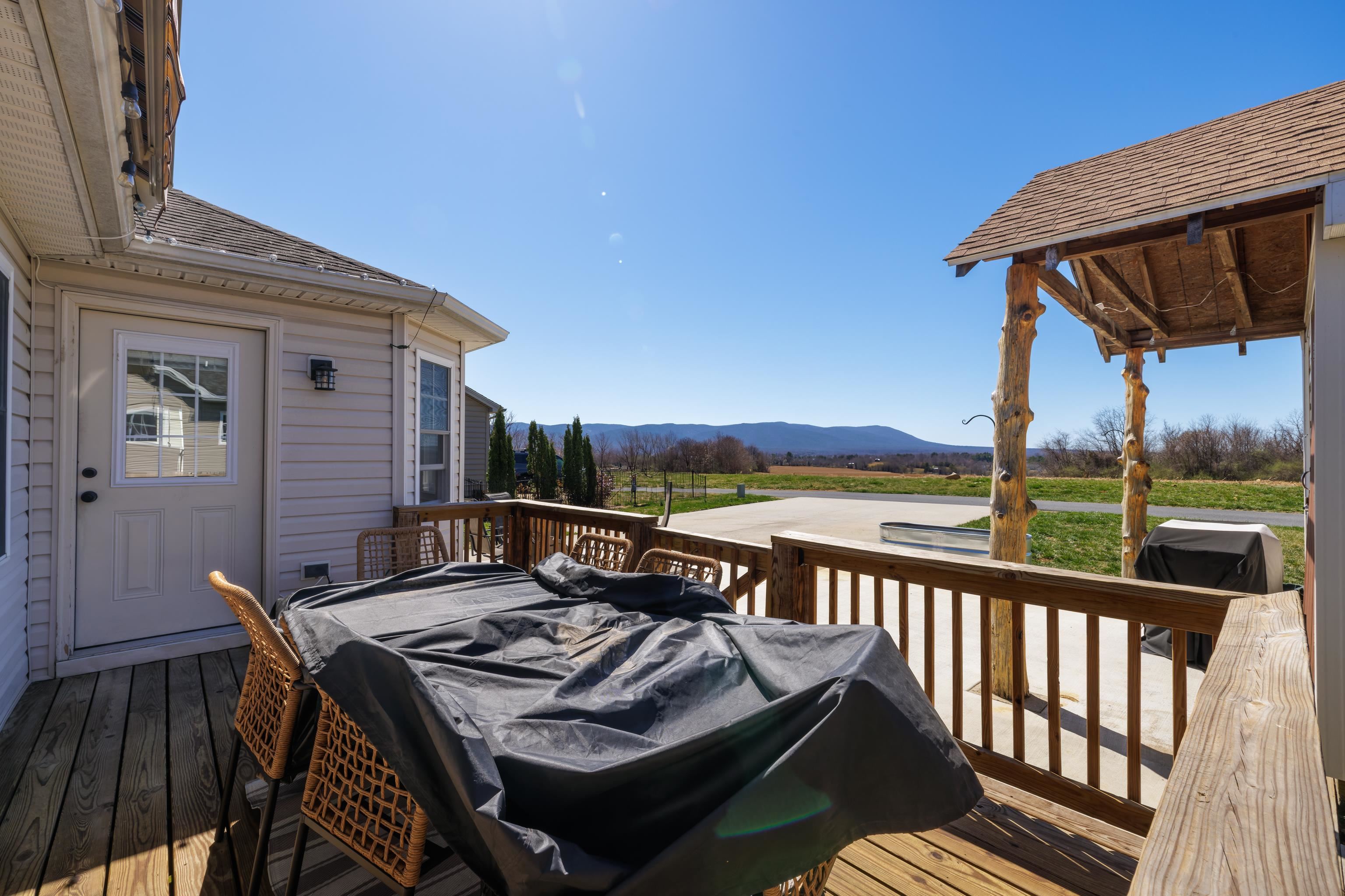 105 Stone Drive Stuarts Draft, VA 24477 - Photo 44 of 62 a view of a patio with a table chairs and a table