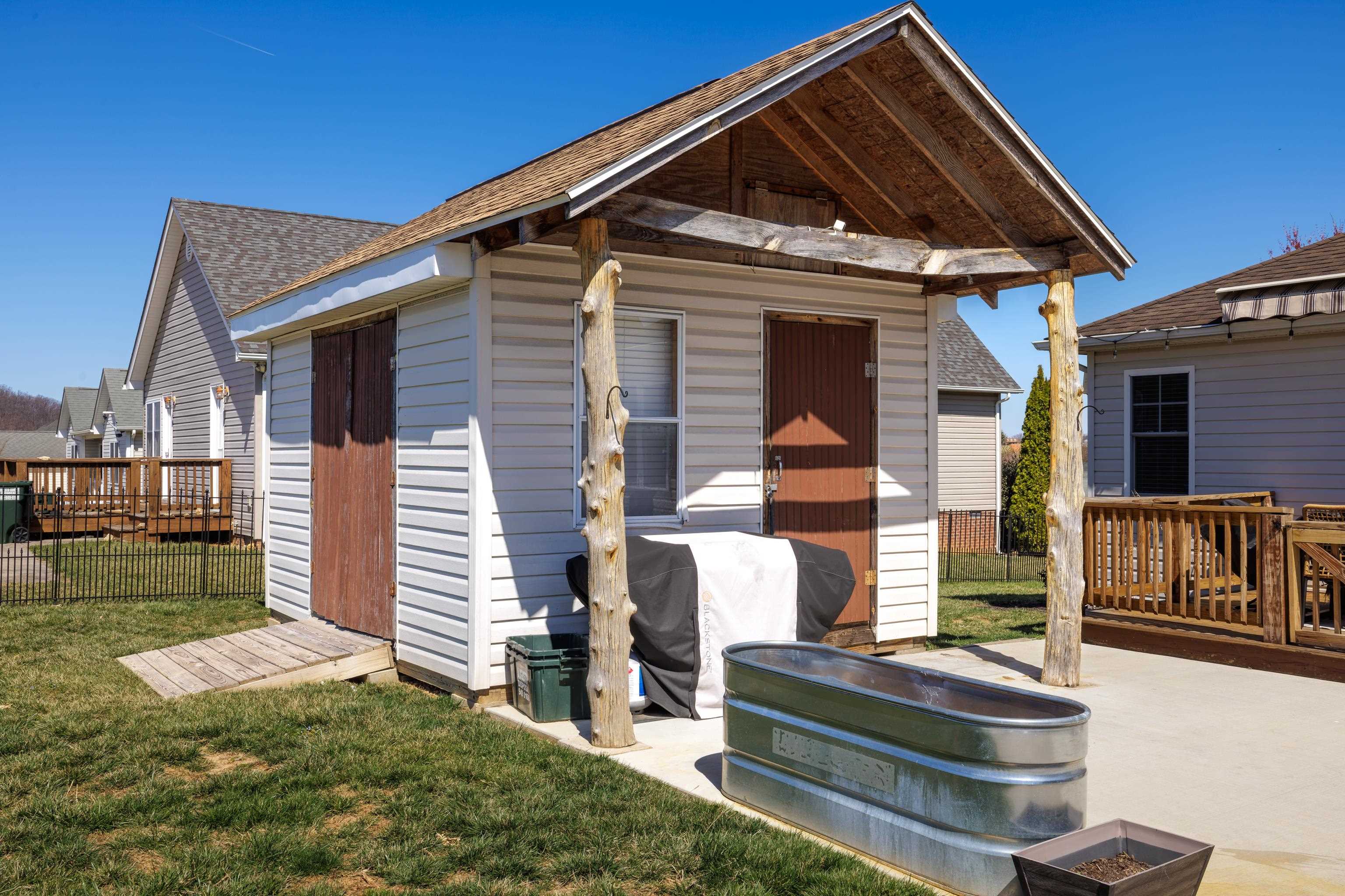 105 Stone Drive Stuarts Draft, VA 24477 - Photo 48 of 62 a front view of a house with garden