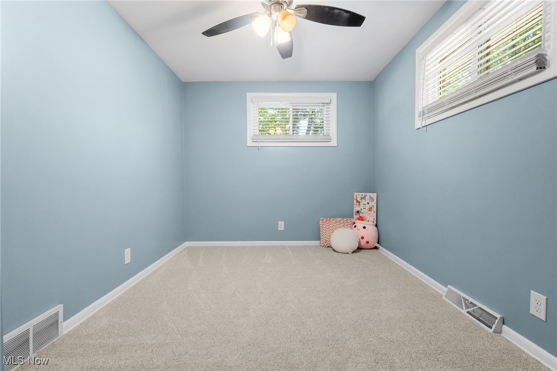 4895 3rd Street Northwest Canton, OH 44708 - Photo 15 of 27 Carpeted empty room with a ceiling fan and baseboards