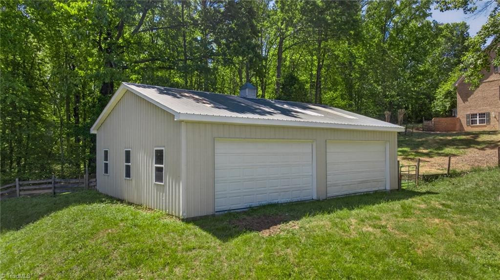 1747 Scalesville Road Summerfield, NC 27358 - Photo 43 of 49 Multi-purpose double sided garage doors