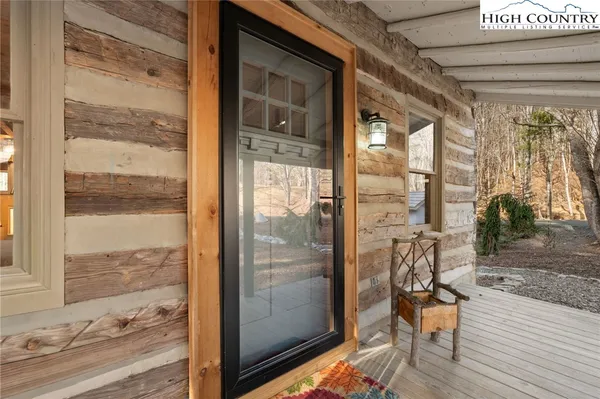 a bathroom with a glass door shower and a sink
