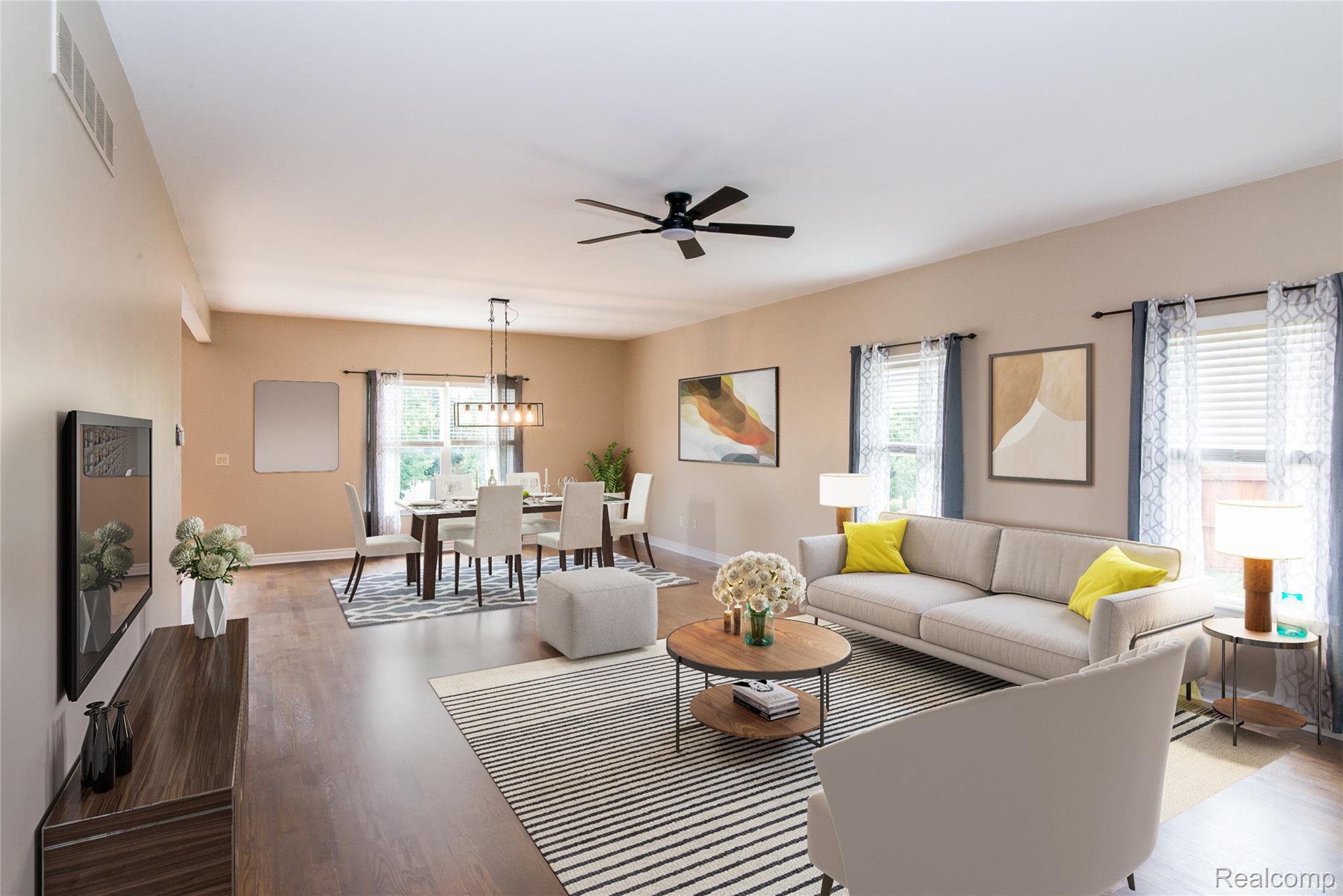 486 Sweet Briar Ridge Linden, MI 48451 - Photo 18 of 69 Open-concept living and dining areas featuring wood-finish flooring, recessed lighting, and a modern ceiling fan
