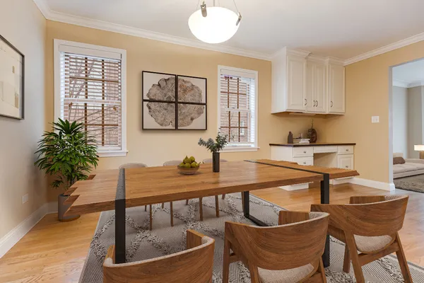 a dining room with furniture and window