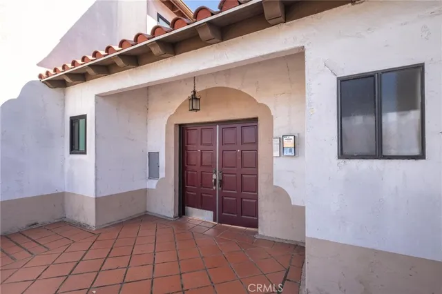 a view of a hallway with entryway and window