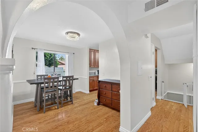 a view of a dining room with furniture and a window
