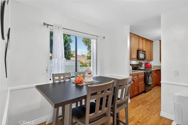 a view of a dining room with furniture and window