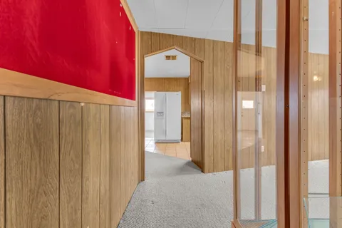 a hallway with sliding door and yard
