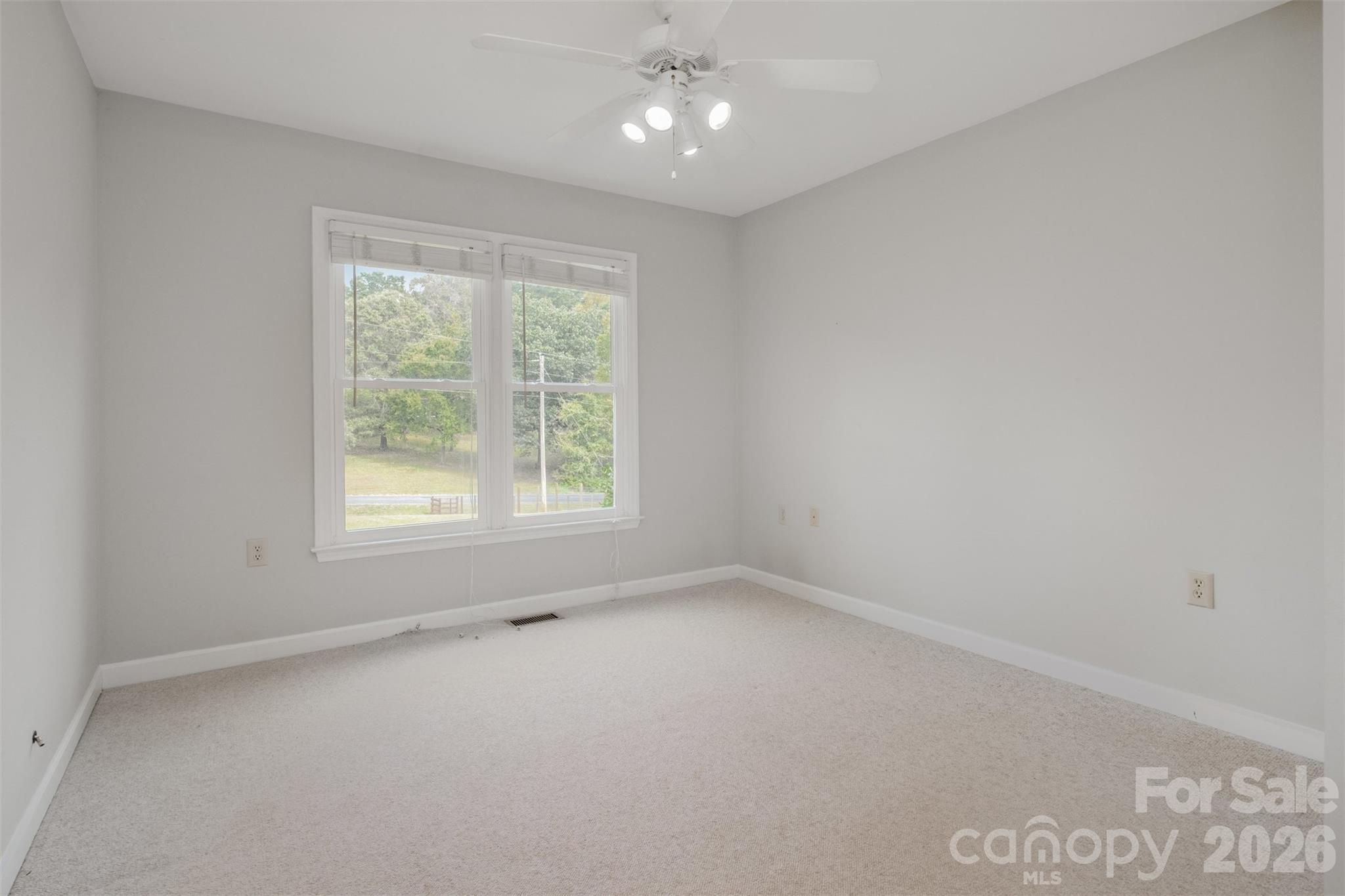 2212 Biggers Cemetery Road Monroe, NC 28110 - Photo 14 of 30 an empty room with a window