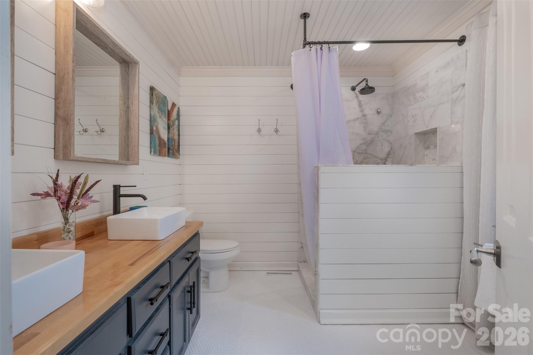 2212 Biggers Cemetery Road Monroe, NC 28110 - Photo 17 of 30 a bathroom with a sink and a mirror