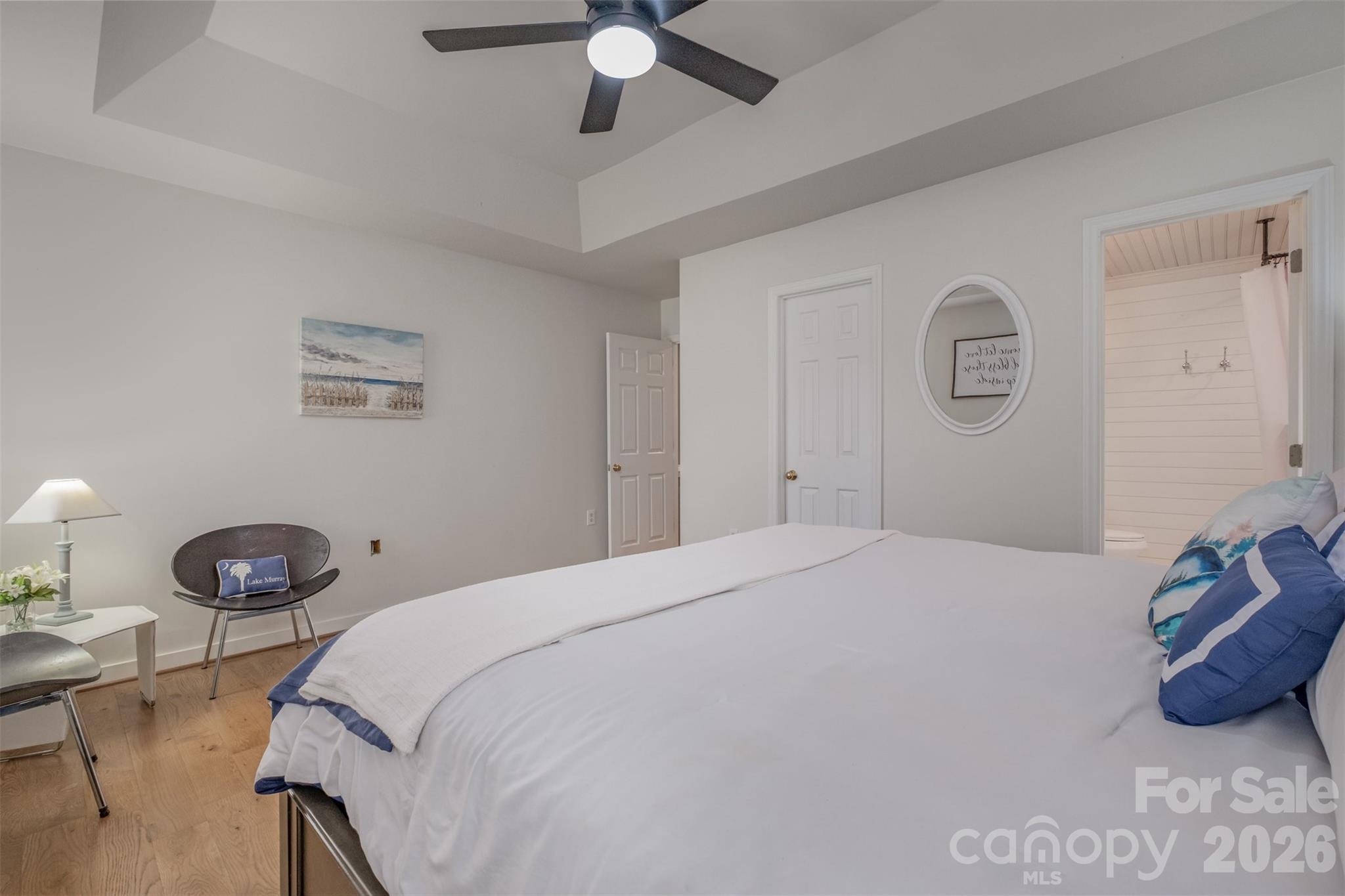 2212 Biggers Cemetery Road Monroe, NC 28110 - Photo 18 of 30 a bedroom with a bed and a chandelier