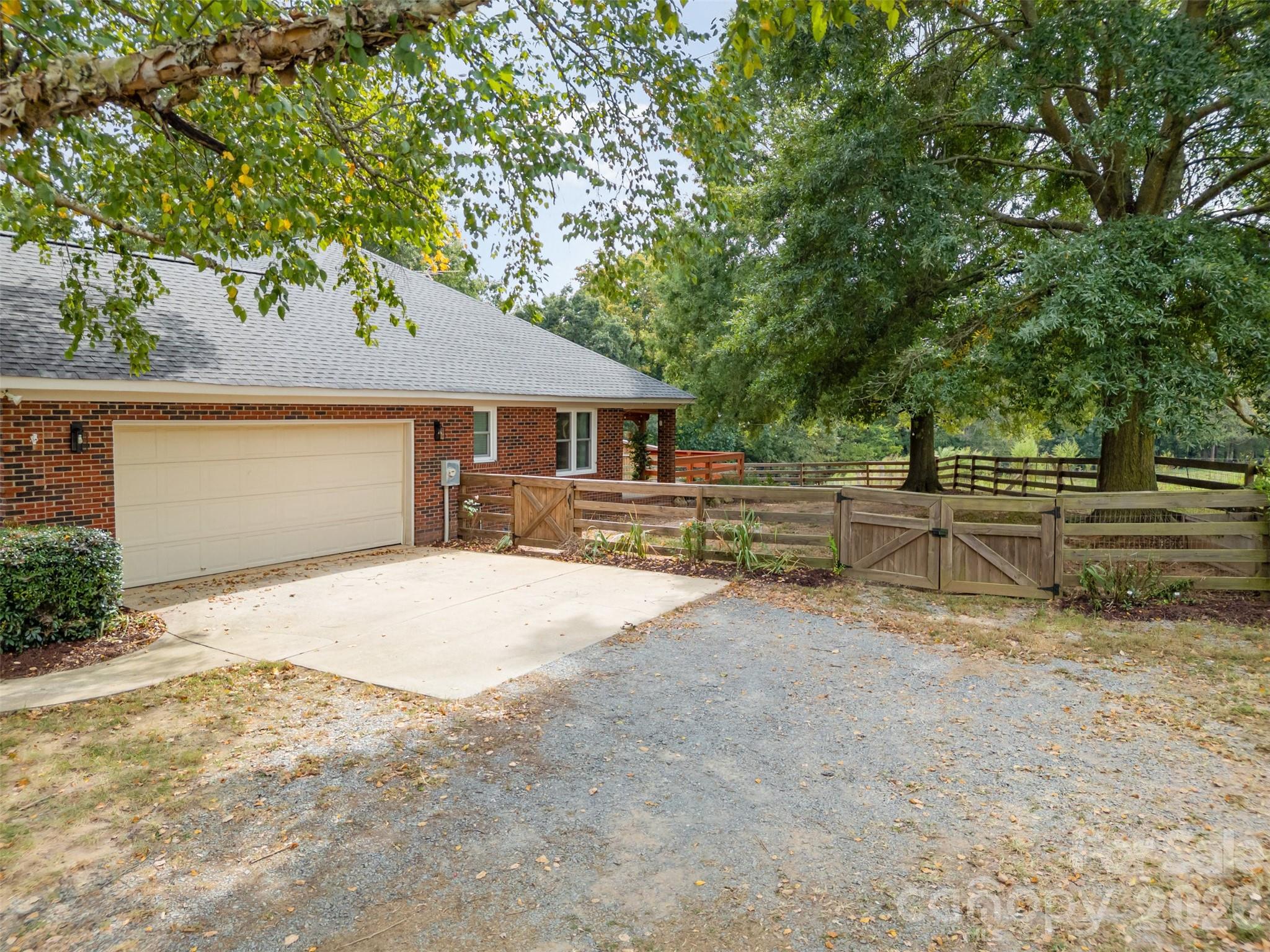 2212 Biggers Cemetery Road Monroe, NC 28110 - Photo 2 of 30 a house with trees in the background