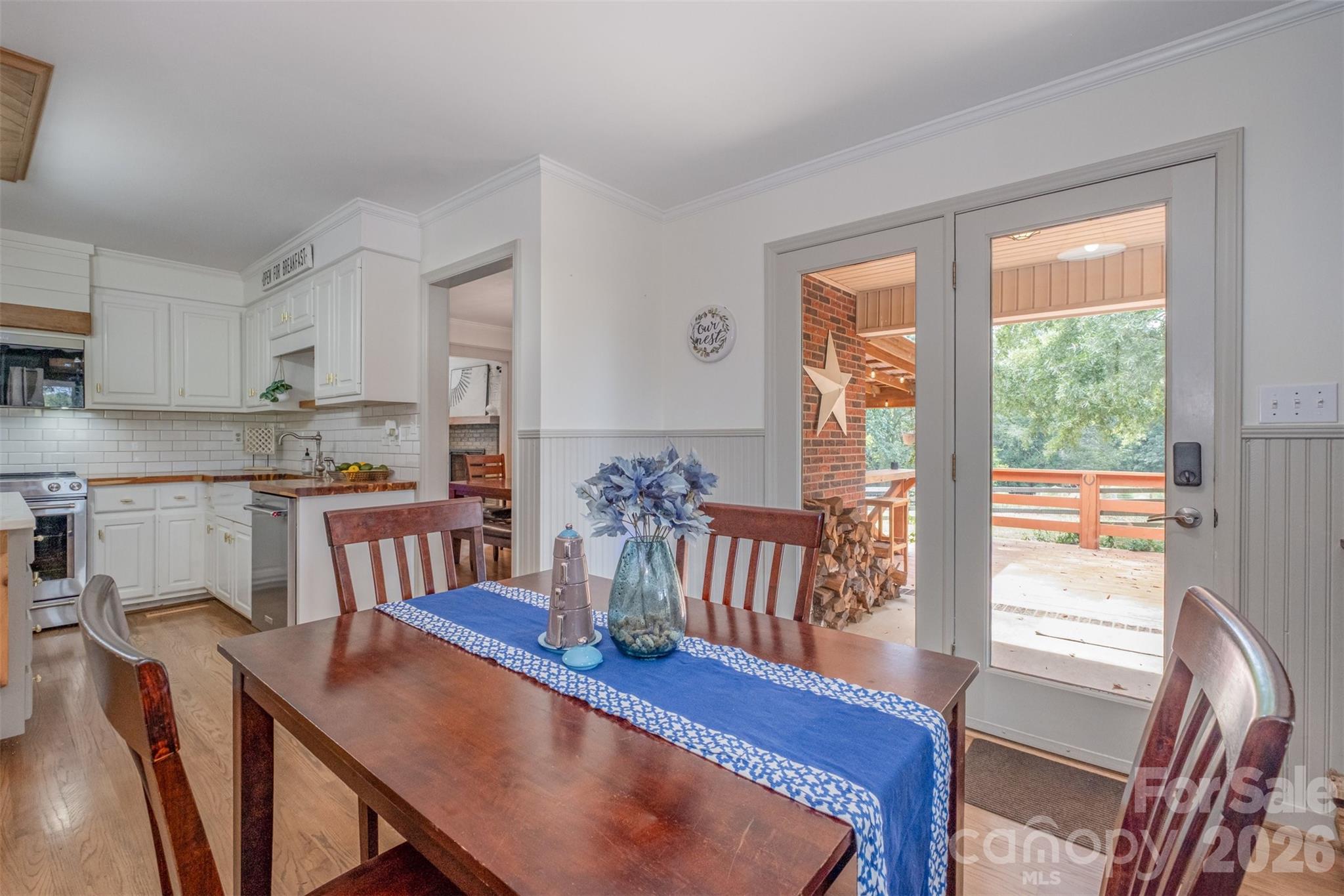 2212 Biggers Cemetery Road Monroe, NC 28110 - Photo 21 of 30 a view of a dining room with furniture window and wooden floor