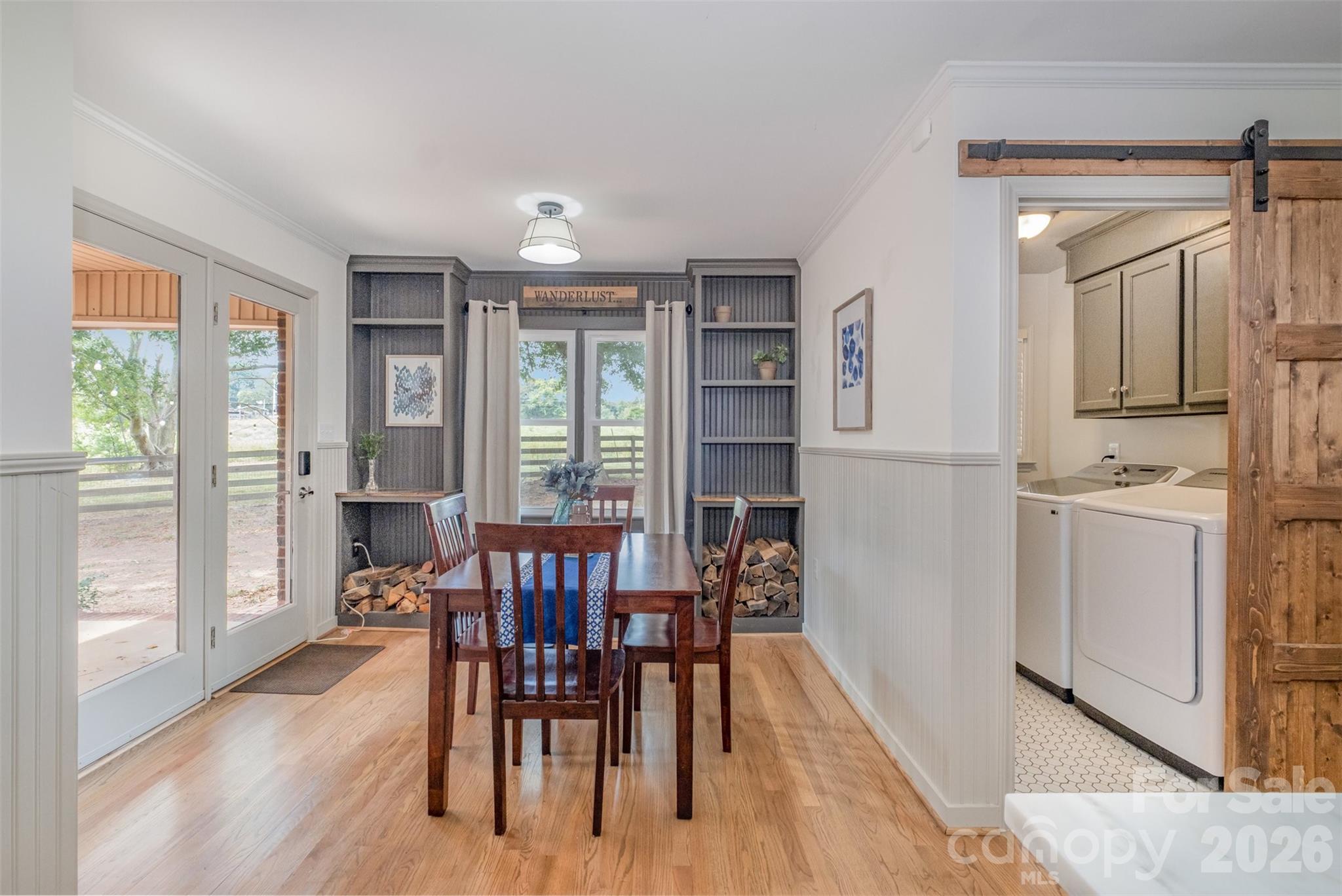 2212 Biggers Cemetery Road Monroe, NC 28110 - Photo 22 of 30 a view of a dining room with furniture and wooden floor