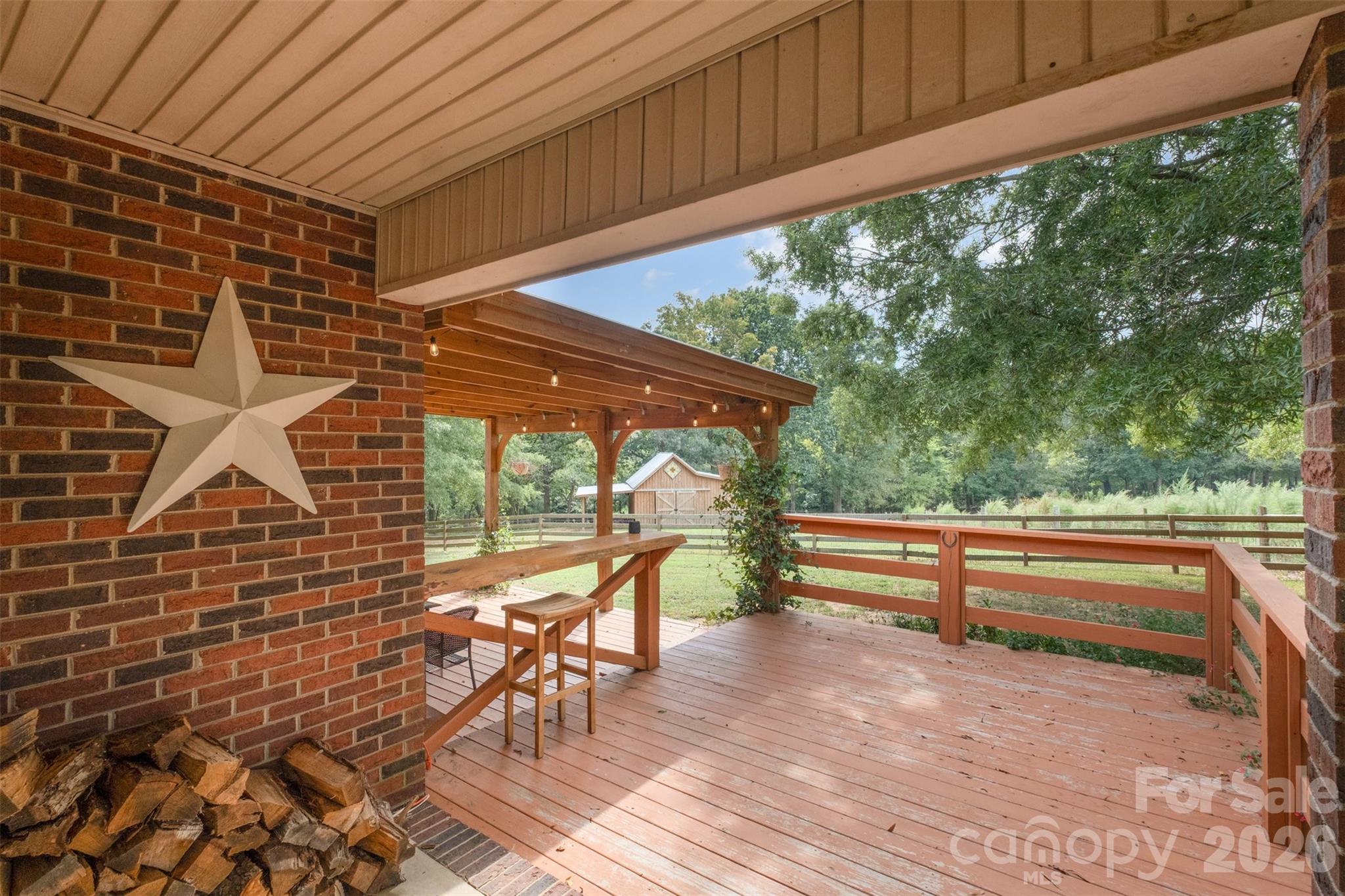 2212 Biggers Cemetery Road Monroe, NC 28110 - Photo 27 of 30 a view of porch with a table and chairs