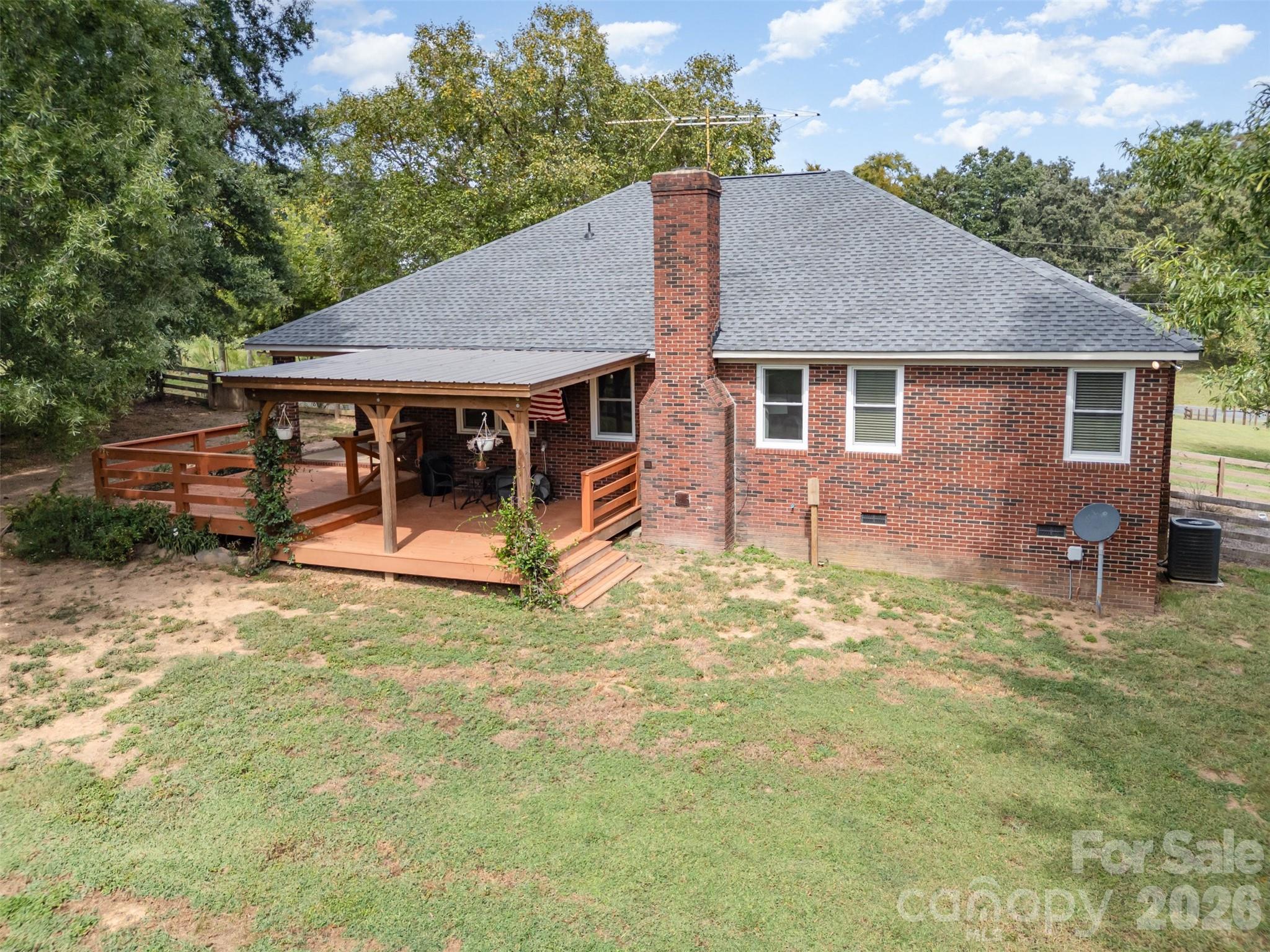 2212 Biggers Cemetery Road Monroe, NC 28110 - Photo 4 of 30 a view of a house with a yard and large tree